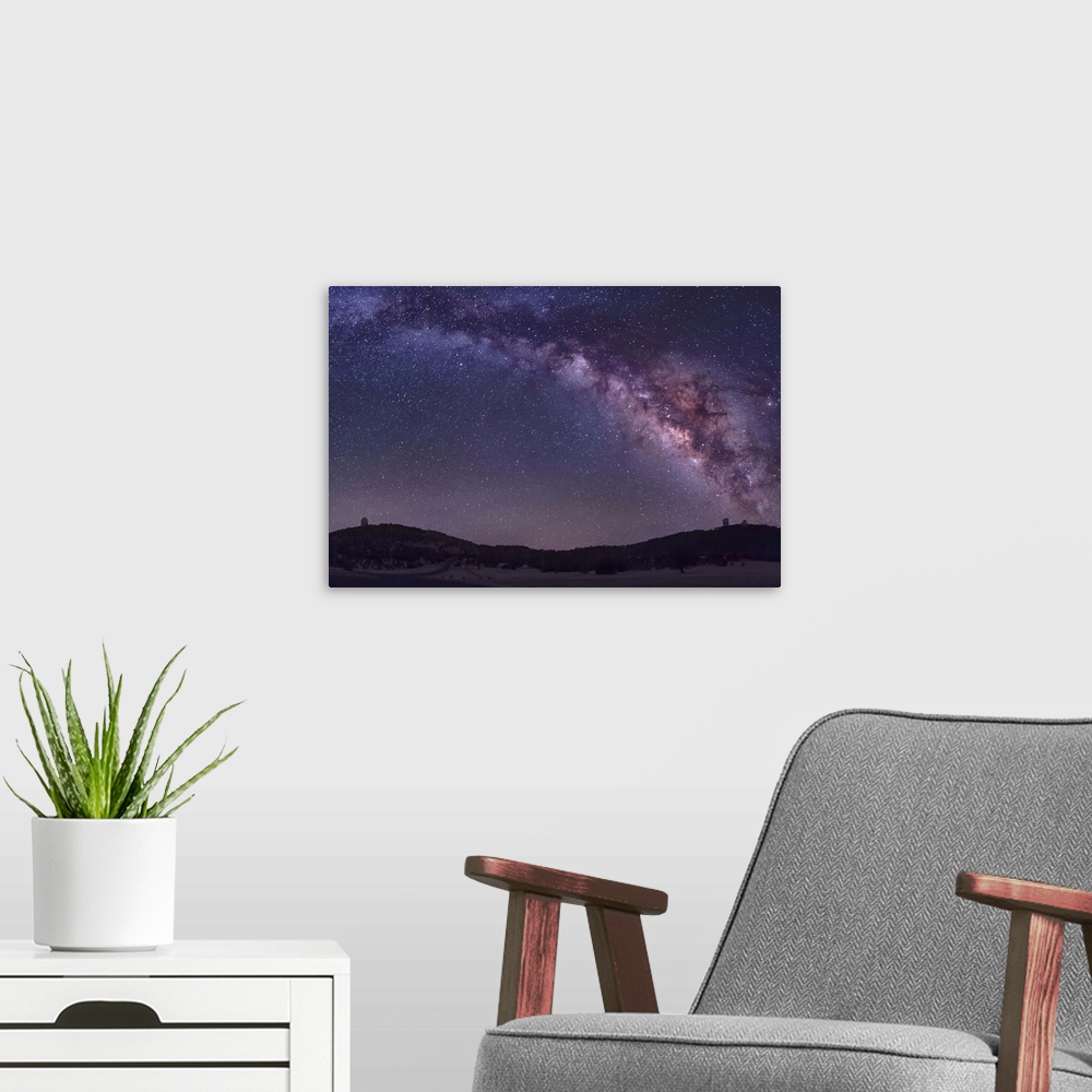 A modern room featuring The summer Milky Way rises over the McDonald Observatory near Fort Davis, Texas.