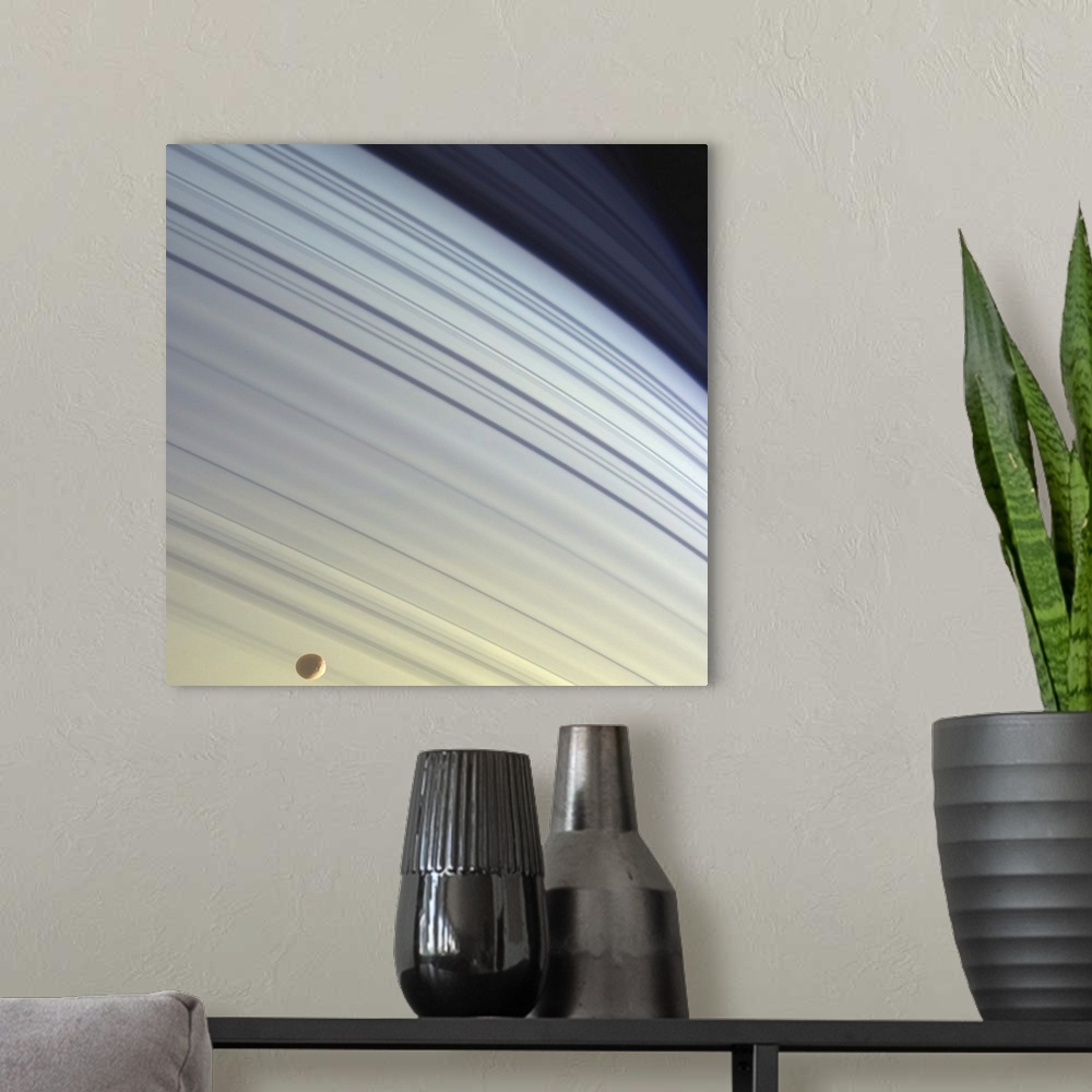 A modern room featuring Mimas drifts along in its orbit against the azure backdrop of Saturns northern latitudes