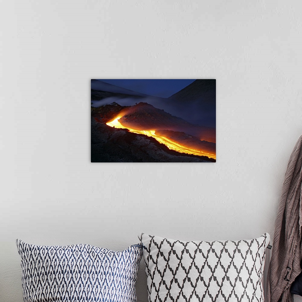 A bohemian room featuring Mount Etna lava flow at night Sicily Italy