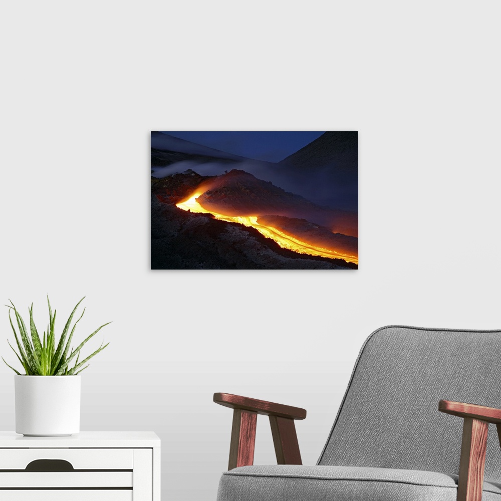 A modern room featuring Mount Etna lava flow at night Sicily Italy