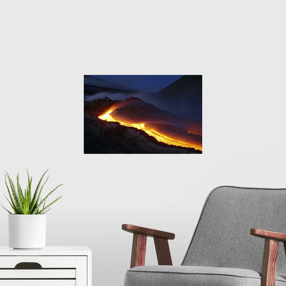 A modern room featuring Mount Etna lava flow at night Sicily Italy
