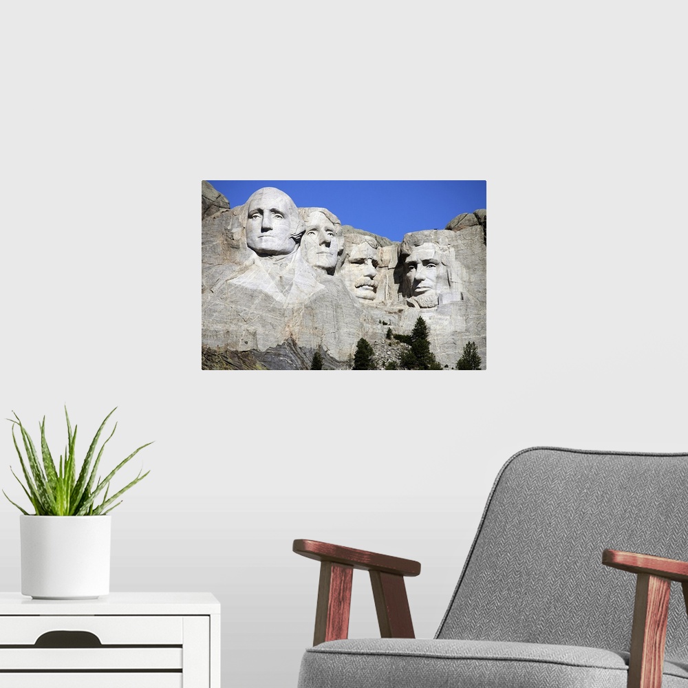A modern room featuring Picture of the four stone heads of past United States Presidents that make up the National Park o...