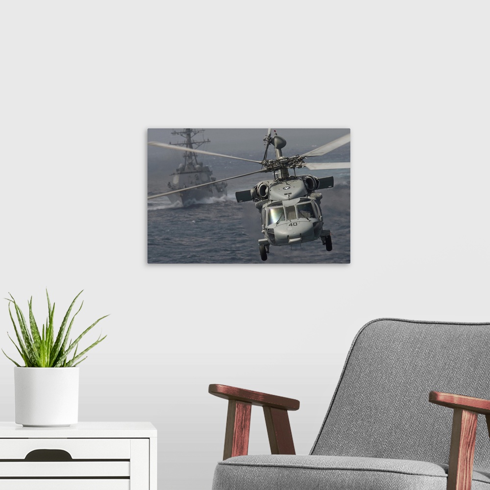 A modern room featuring Pacific Ocean, January 2, 2012 - An MH-60S Knight Hawk passes the Arleigh Burke-class guided-miss...