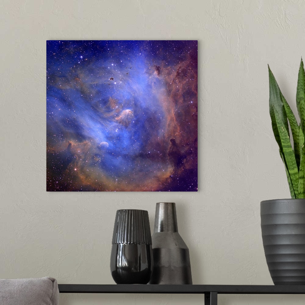 A modern room featuring Photograph of stars and nebula's in outer space.