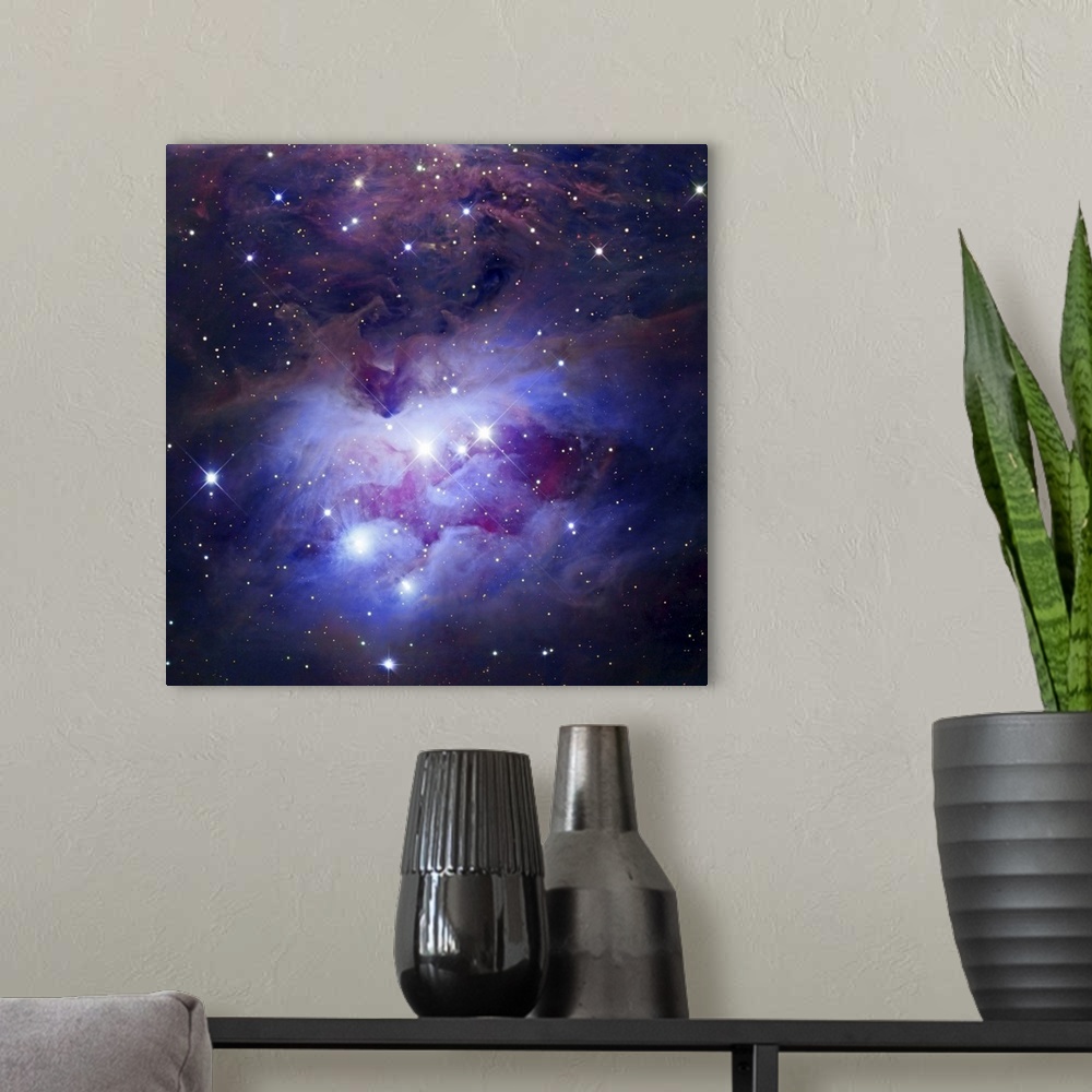 A modern room featuring Photograph of interstellar cloud of dust, hydrogen, and helium covered in stars.