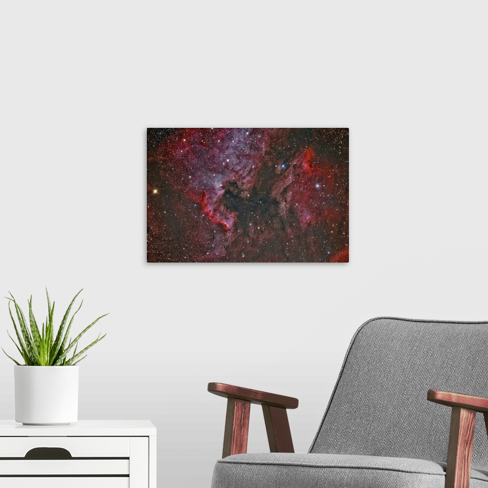 A modern room featuring NGC 7000 North America Nebula and IC 5070 Pelican Nebula.