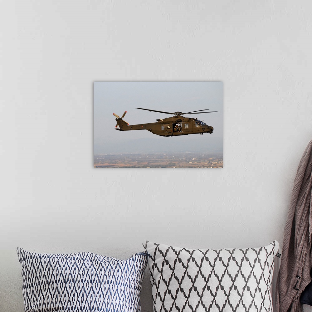 A bohemian room featuring NH-90 Italian Army helicopter taken in-flight during a training mission.