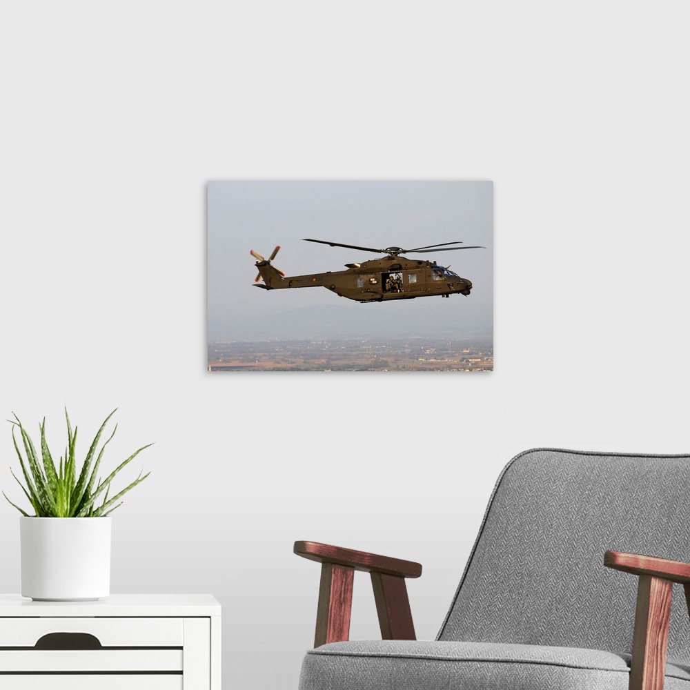 A modern room featuring NH-90 Italian Army helicopter taken in-flight during a training mission.