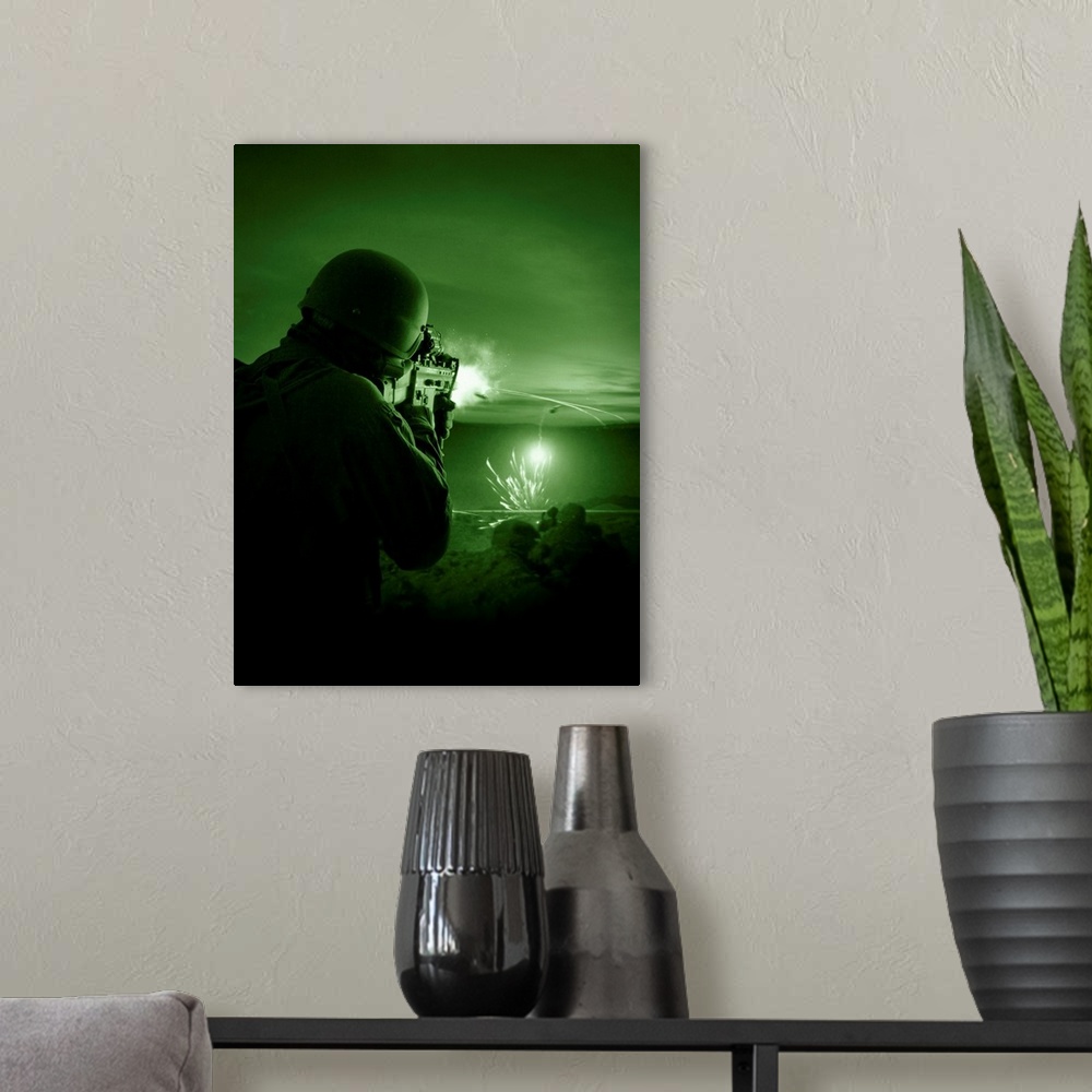 A modern room featuring Night vision view of a special operations forces soldier firing his weapon during combat.