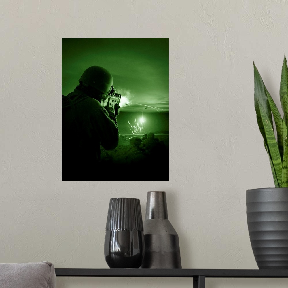A modern room featuring Night vision view of a special operations forces soldier firing his weapon during combat.