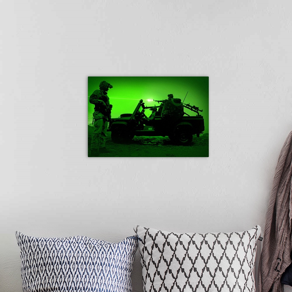 A bohemian room featuring Night vision view of U.S. Special Forces on patrol in a special operation vehicle.