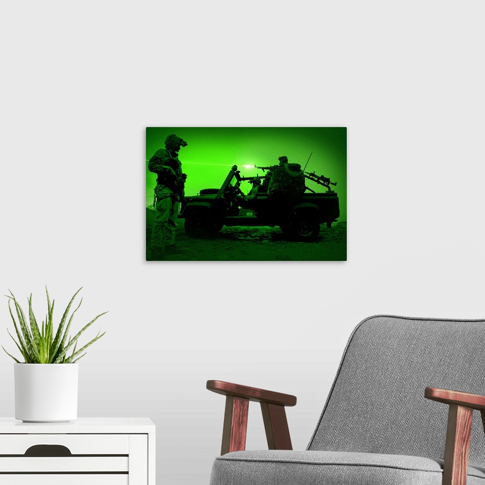 A modern room featuring Night vision view of U.S. Special Forces on patrol in a special operation vehicle.