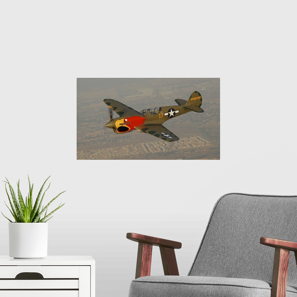 A modern room featuring P-40 Warhawk flying over Chino, California.