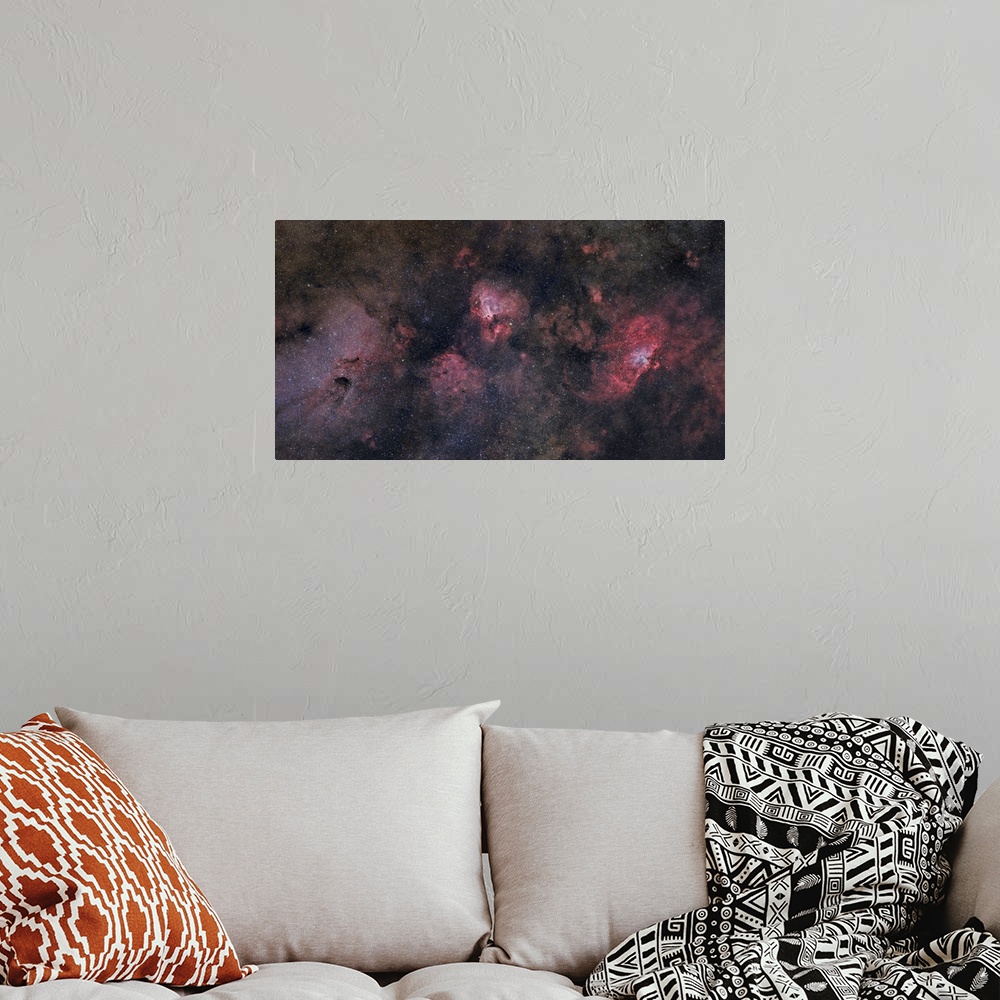 A bohemian room featuring This large field contains many famous objects including the Eagle Nebula, Swan Nebula, Lobster Ne...