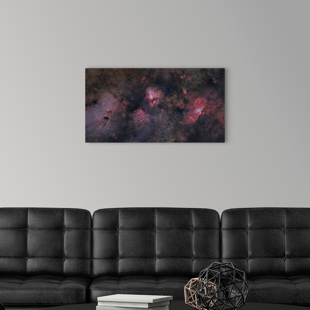 A modern room featuring This large field contains many famous objects including the Eagle Nebula, Swan Nebula, Lobster Ne...