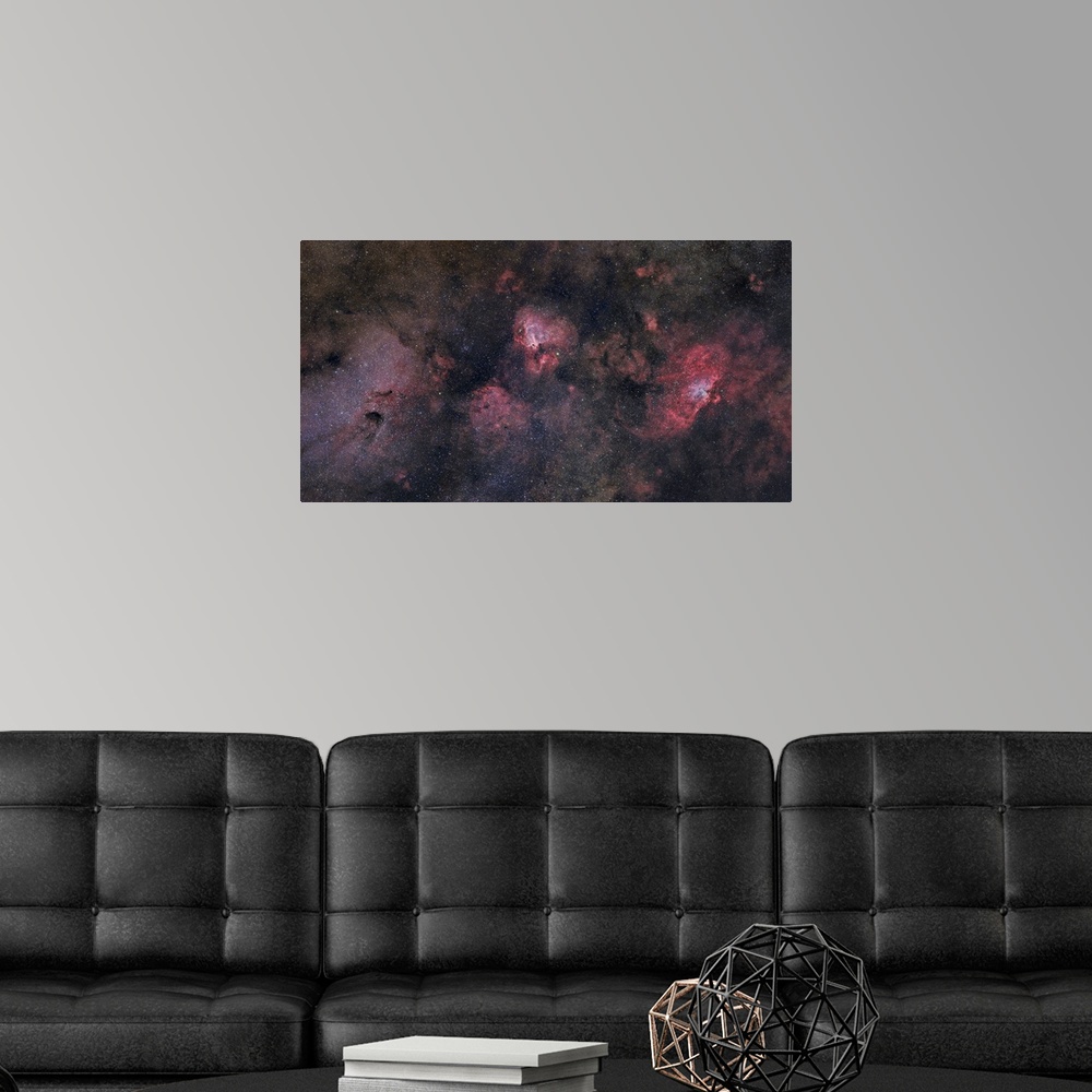 A modern room featuring This large field contains many famous objects including the Eagle Nebula, Swan Nebula, Lobster Ne...