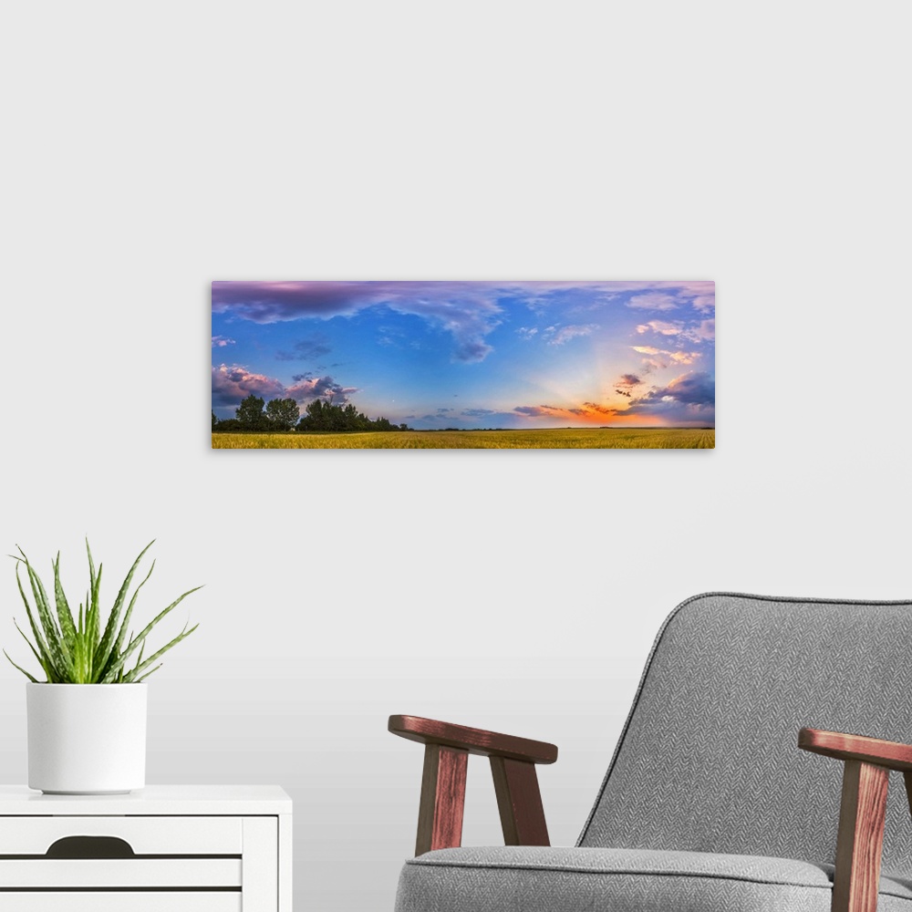 A modern room featuring August 6, 2014 - The colors of the sunset sky in a 360 degree panorama at sunset in Alberta, Cana...