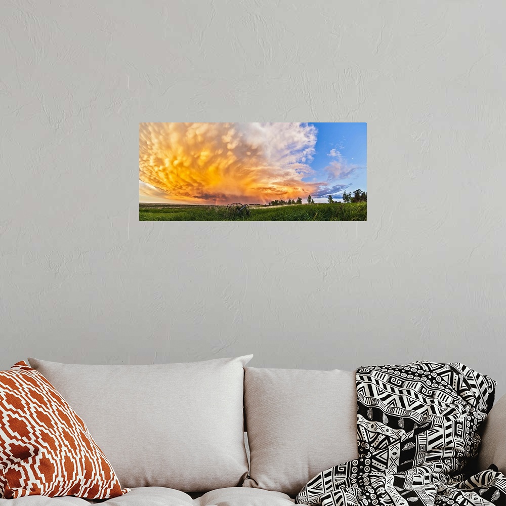 A bohemian room featuring June 17, 2013 - Panoramic view of a retreating thunderstorm at sunset, Alberta, Canada. The storm...