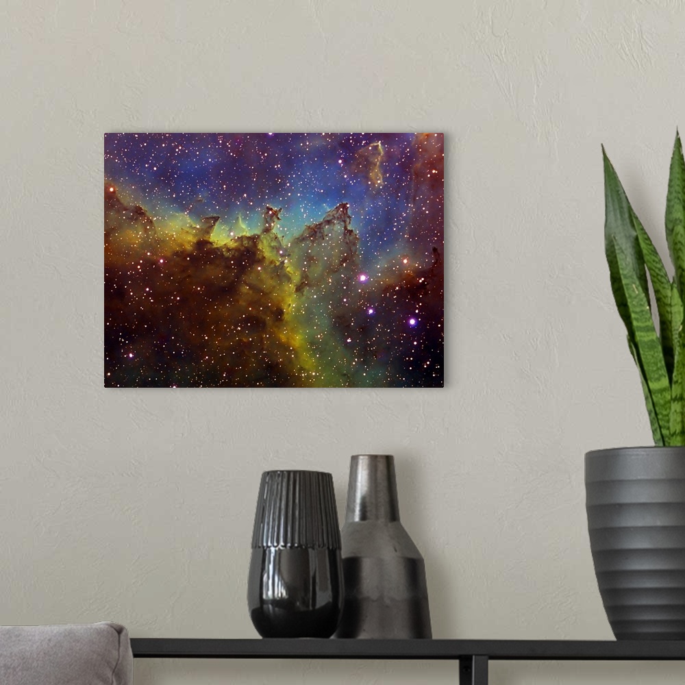 A modern room featuring Photograph of stars with multicolored waves of gas and clouds in the background.
