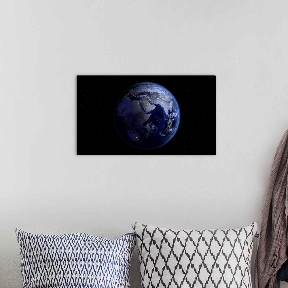 A bohemian room featuring Planet Earth showing Africa, Europe and Asia, half night and half day with city lights