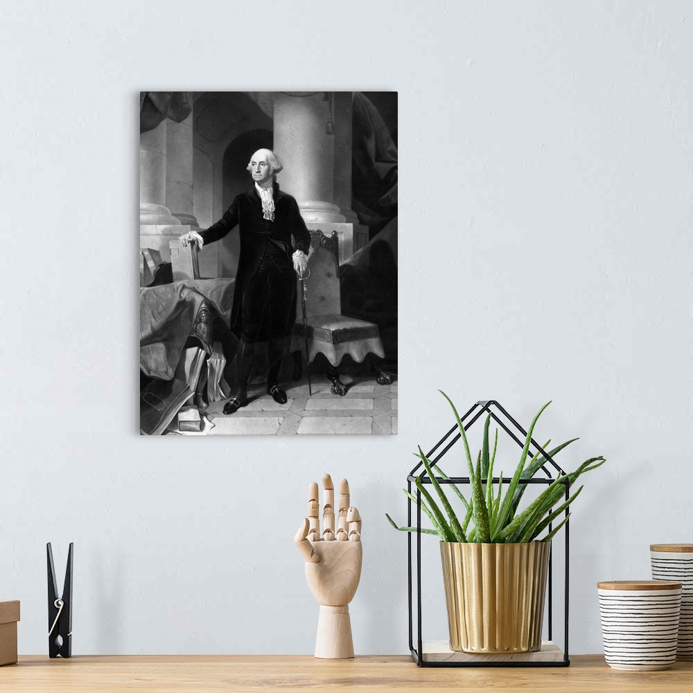 A bohemian room featuring Vintage American History print of President George Washington standing, with one hand on a book a...