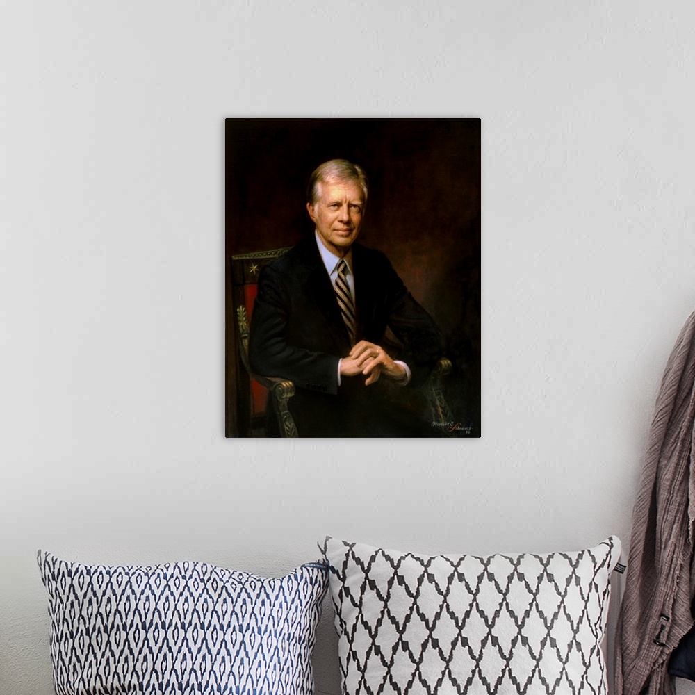 A bohemian room featuring Presidential portrait of Jimmy Carter.
