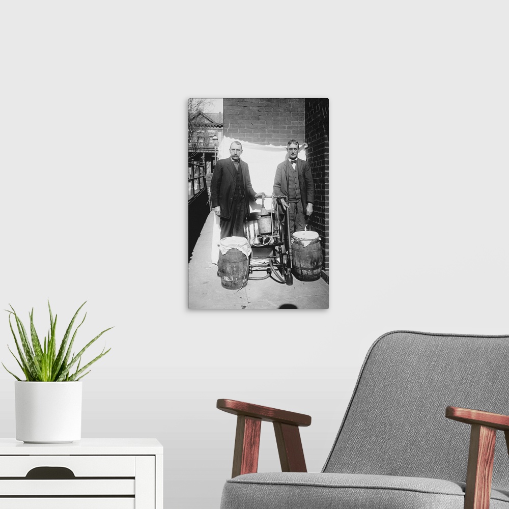 A modern room featuring Prohibition era photograph of two men posing with an illegal whiskey still.