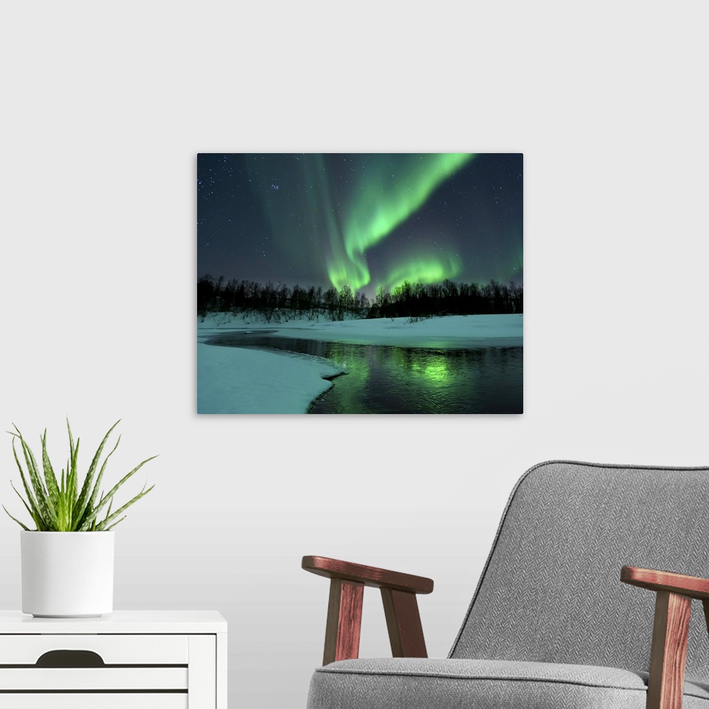A modern room featuring Reflected aurora over a frozen Laksa Lake, Nordland, Norway.