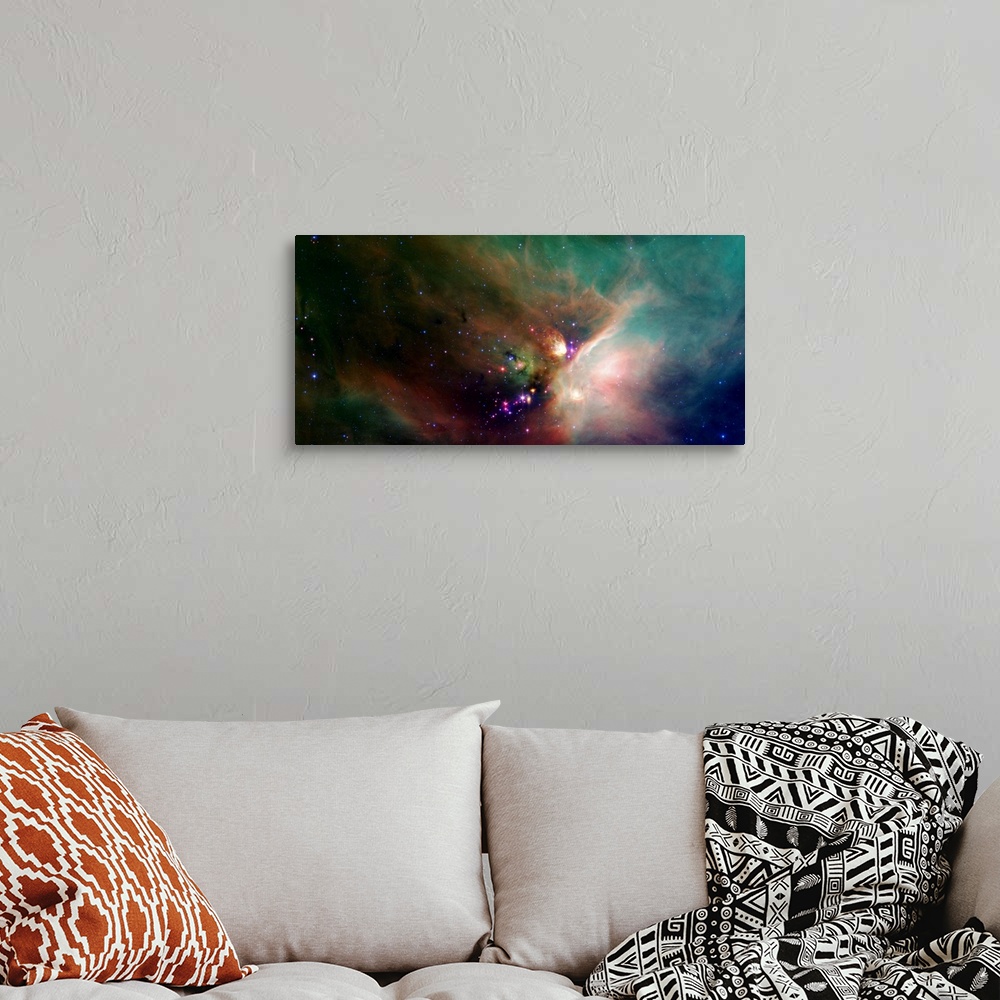 A bohemian room featuring Photo of a colorful nebula in space with stars all around.