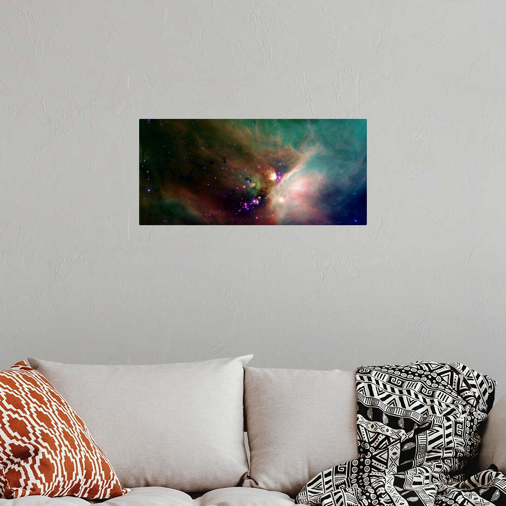 A bohemian room featuring Photo of a colorful nebula in space with stars all around.