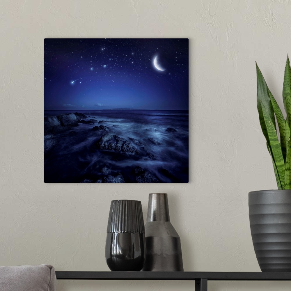 A modern room featuring Rising moon over ocean and boulders against starry sky and falling meteorites.