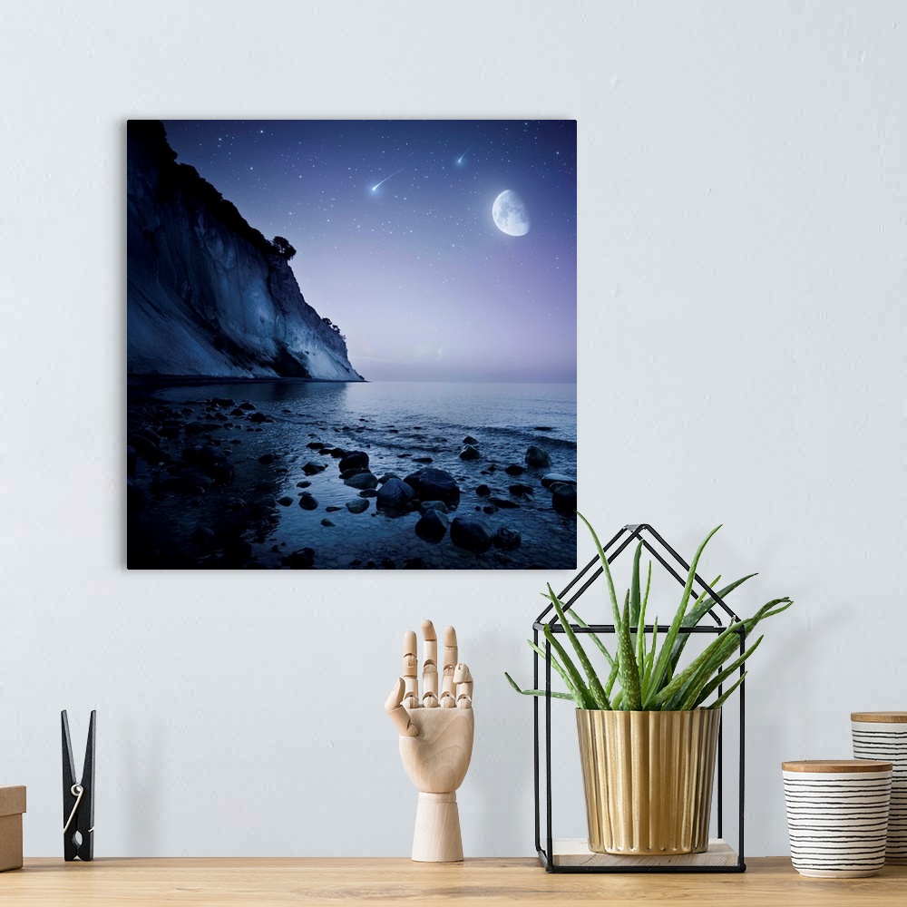 A bohemian room featuring Rising moon over ocean and mountains against starry sky and falling meteorites.