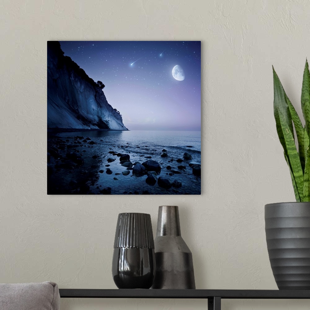 A modern room featuring Rising moon over ocean and mountains against starry sky and falling meteorites.