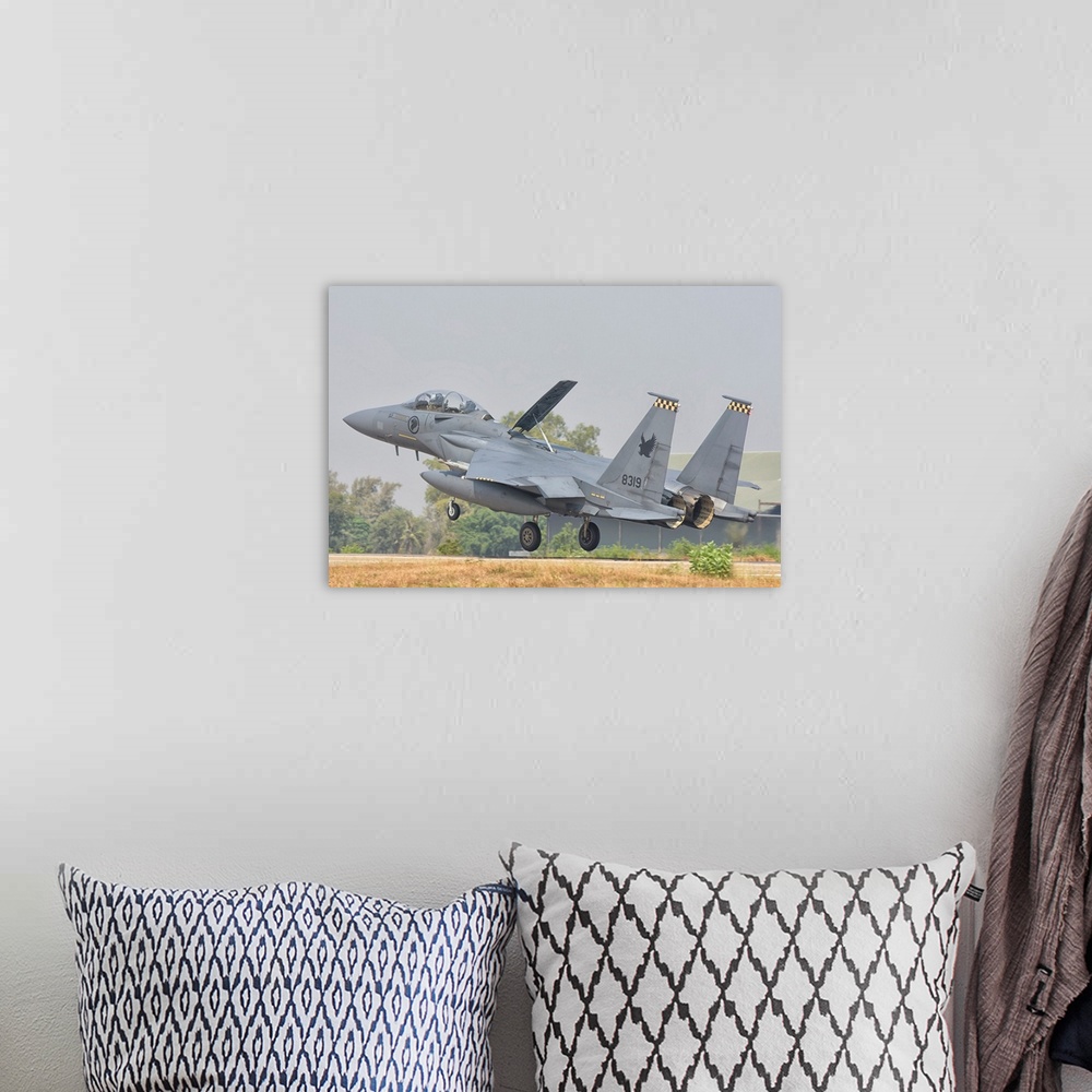 A bohemian room featuring Royal Singapore Air Force F-15E Strike Eagle.