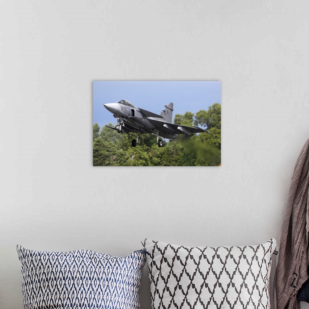 A bohemian room featuring Saab JAS-39C Gripen jet fighter of the Czech Air Force landing during RIAT-2017 airshow, Fairford...