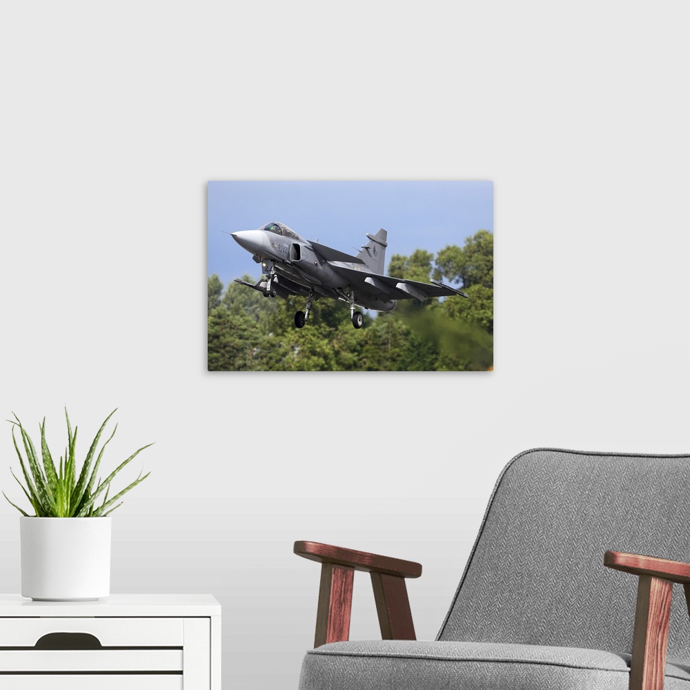 A modern room featuring Saab JAS-39C Gripen jet fighter of the Czech Air Force landing during RIAT-2017 airshow, Fairford...