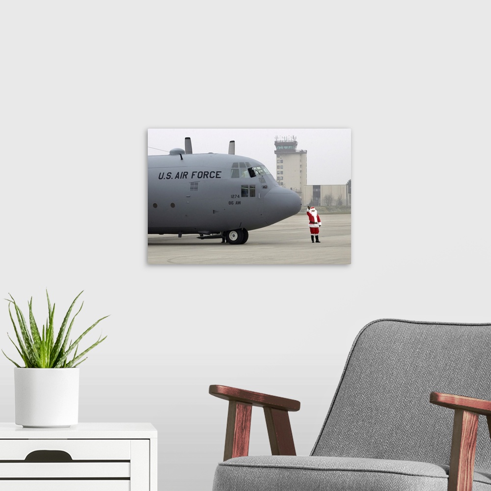 A modern room featuring Ramstein Air Base, Germany, December 12, 2004 - Santa arrives by a C-130 Hercules.
