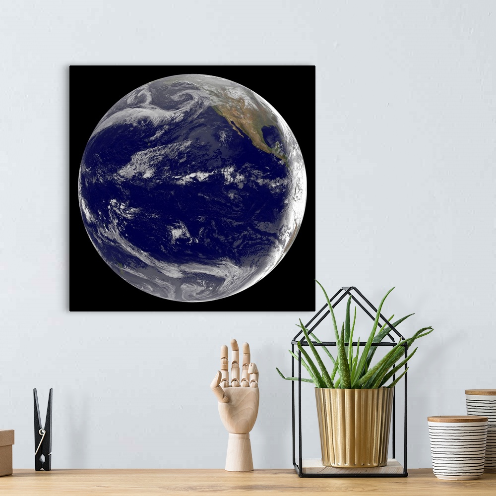 A bohemian room featuring Satellite image of Earth over the Pacific Ocean on March 11, 2011. Waves from the powerful 8.9 Ri...