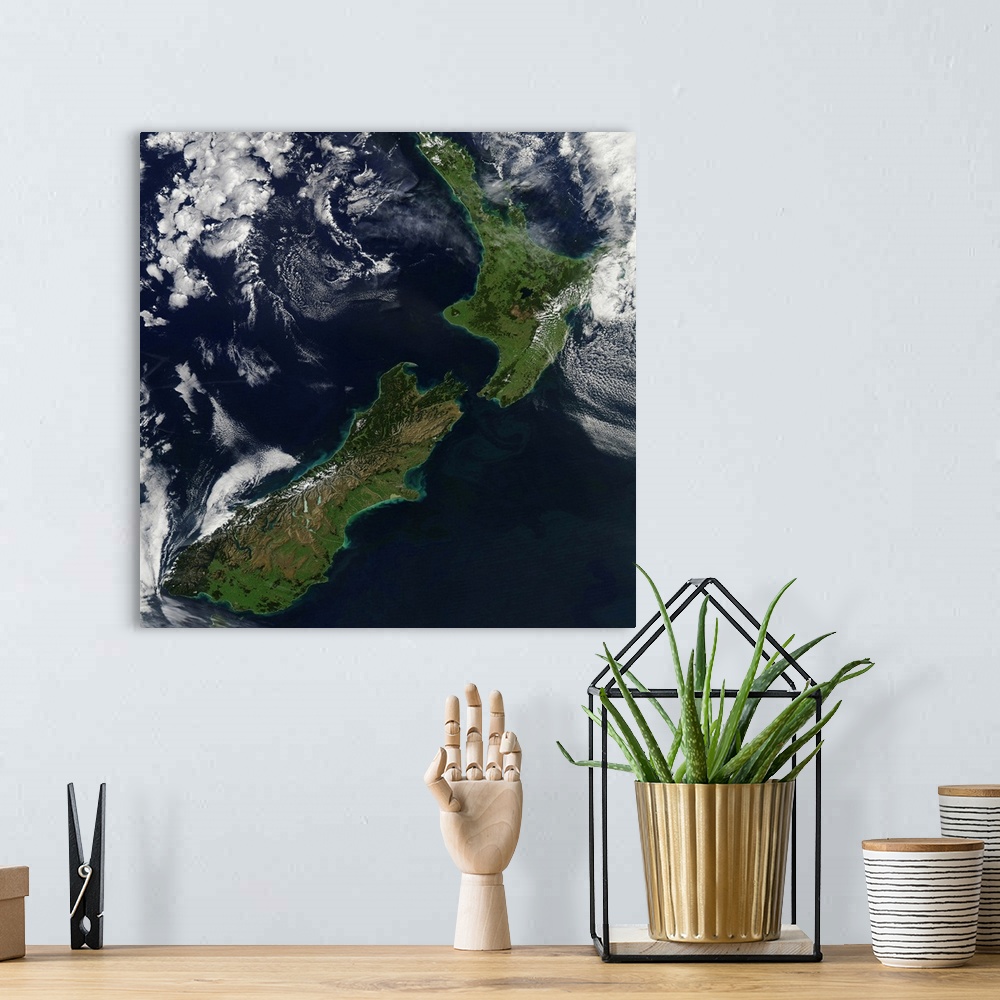 A bohemian room featuring March 30, 2011 - Satellite view of New Zealand. Near the top of the image, snow covers the highes...
