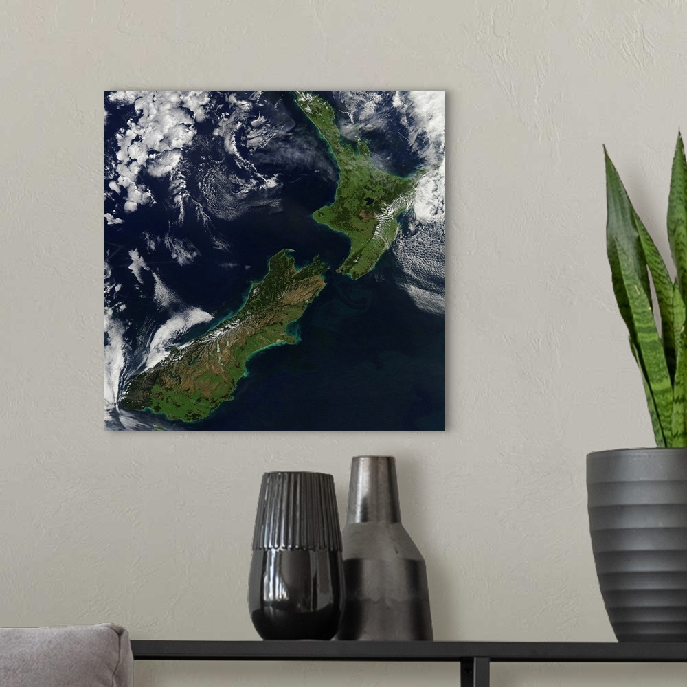 A modern room featuring March 30, 2011 - Satellite view of New Zealand. Near the top of the image, snow covers the highes...