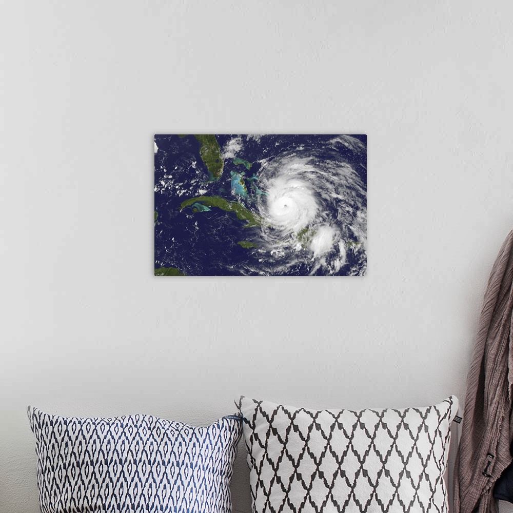 A bohemian room featuring August 24, 2011 - Satellite view of the eye of Hurricane Irene as it enters the Bahamas.