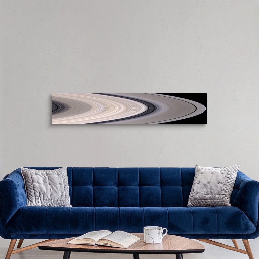 A modern room featuring Long panoramic image of the rings of Saturn in concentric circles.