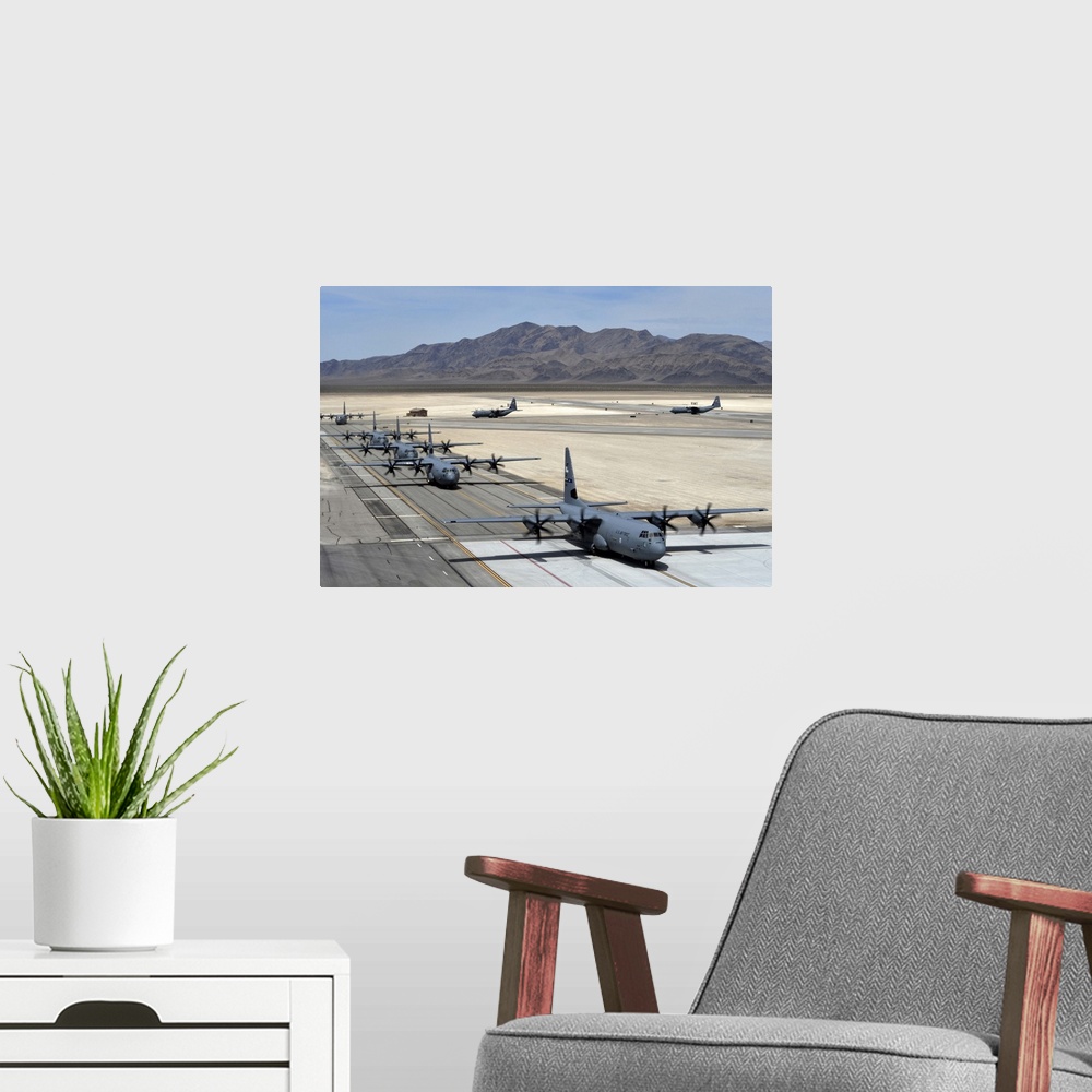 A modern room featuring June 21, 2014 - Seven C-130J Super Hercules taxi after landing during the Joint Forcible Entry ex...
