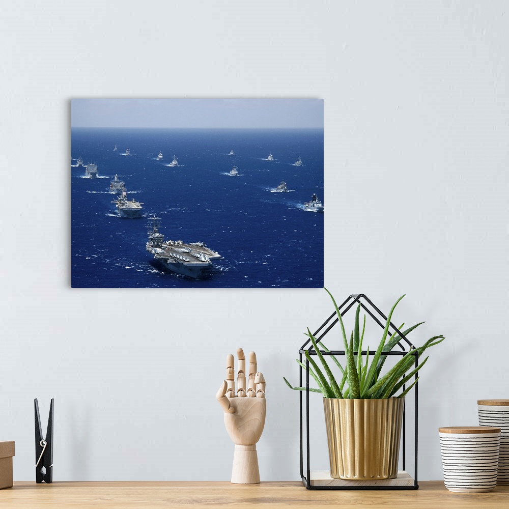 A bohemian room featuring Ships and submarines participating in the Rim of the Pacific exercise.