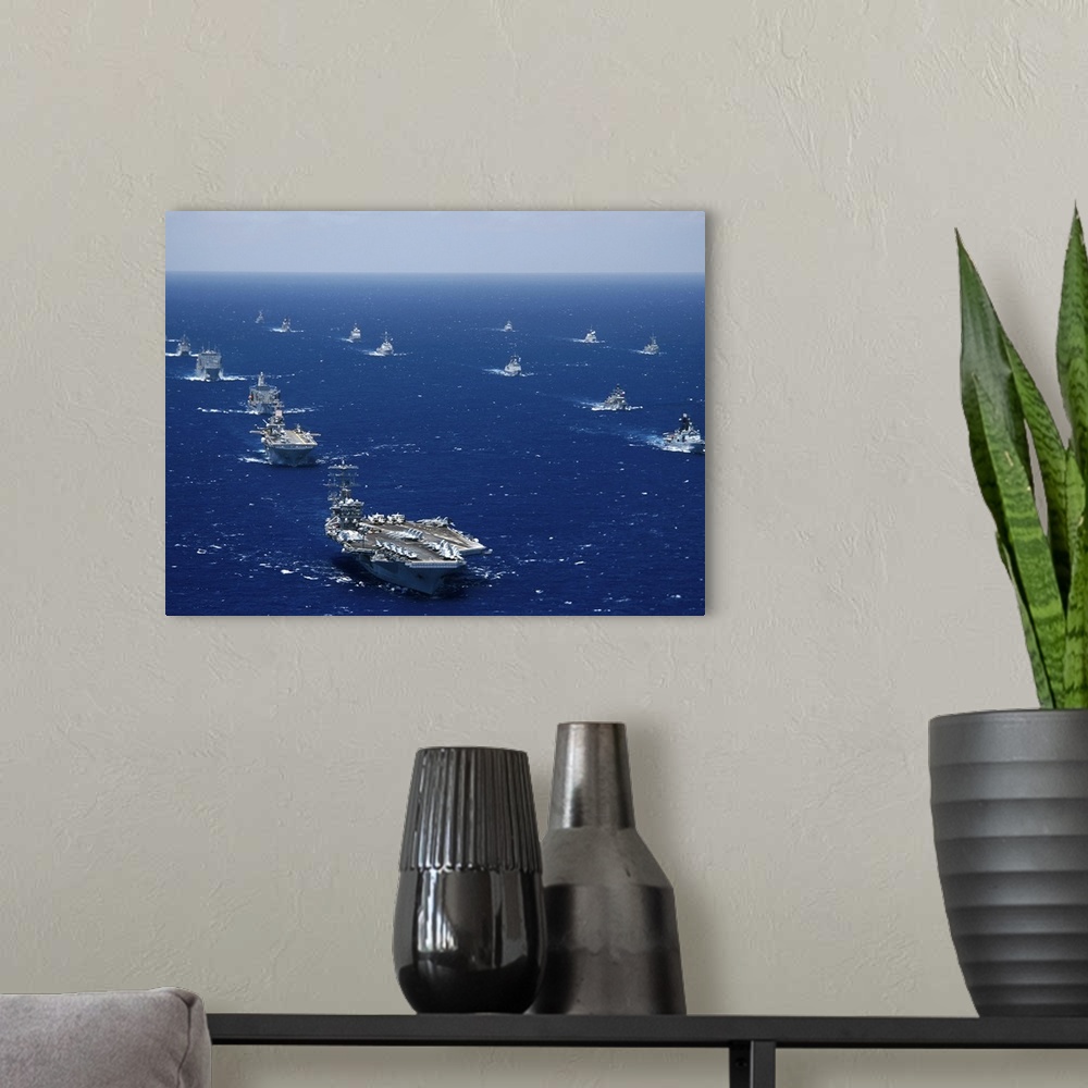 A modern room featuring Ships and submarines participating in the Rim of the Pacific exercise.