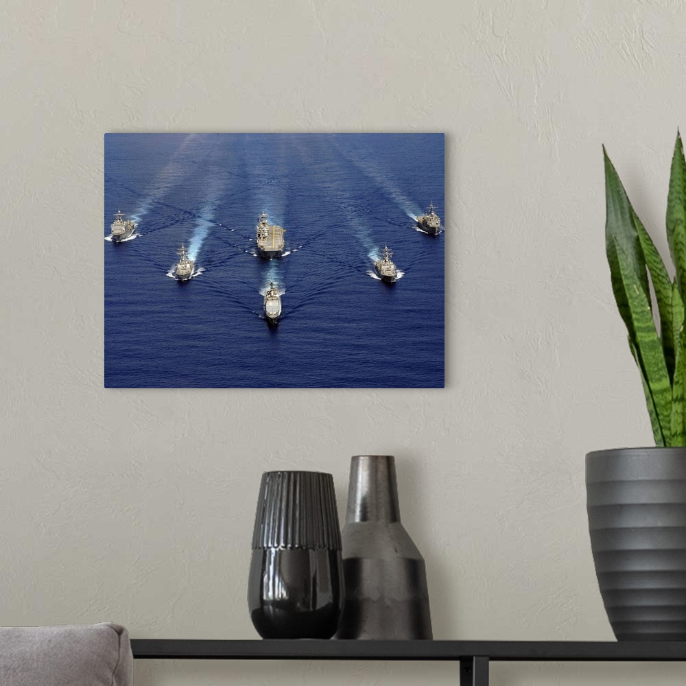 A modern room featuring Ships of the Nassau Strike Group transit westward in the Atlantic Ocean.