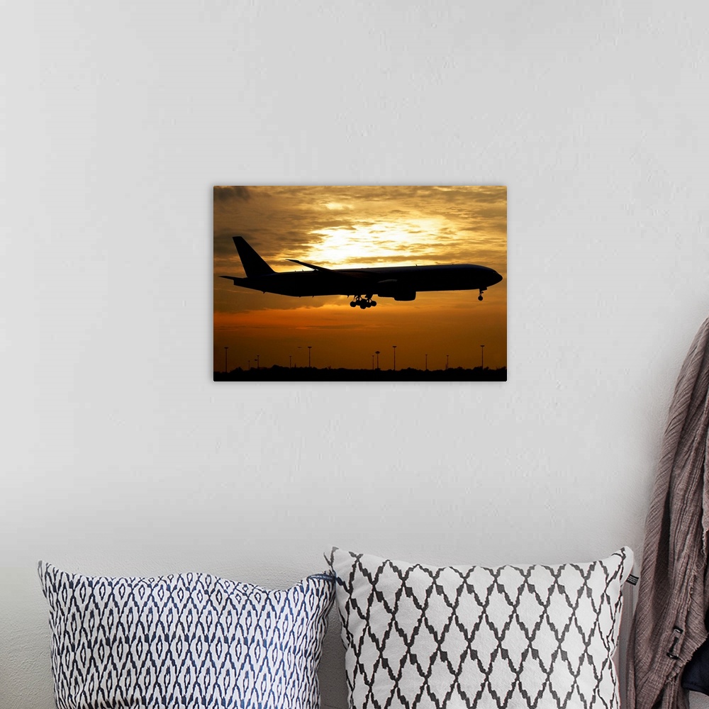 A bohemian room featuring Silhouette of a Pakistan International Airlines Boeing 777, Milano Malpensa Airport, Italy.