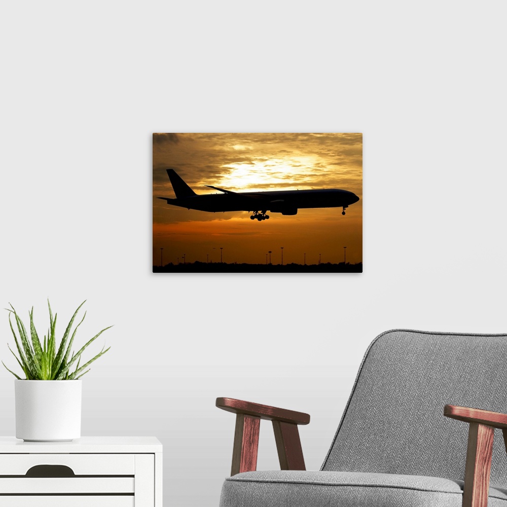 A modern room featuring Silhouette of a Pakistan International Airlines Boeing 777, Milano Malpensa Airport, Italy.