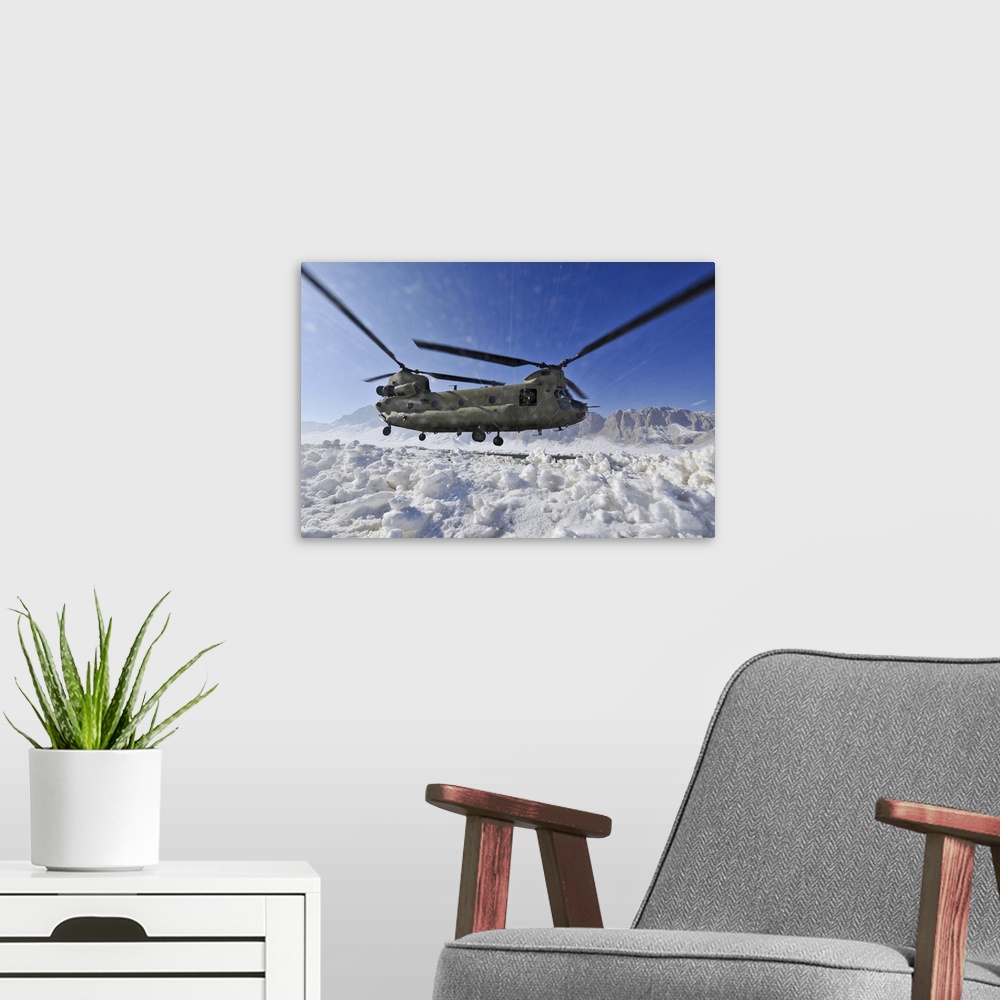 A modern room featuring February 8, 2012 - Snow flies up as a U.S. Army CH-47 Chinook helicopter lands at a remote landin...