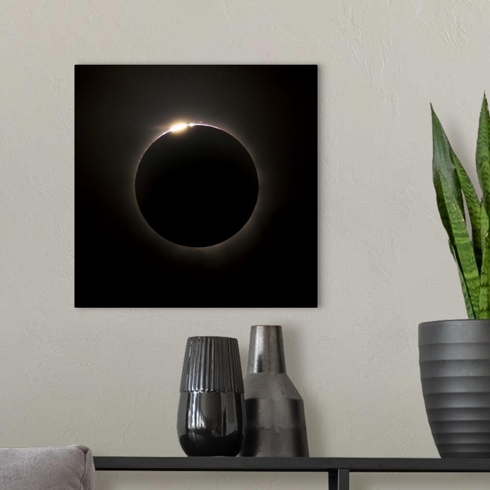 A modern room featuring Solar Eclipse with prominences and diamond ring effect, Queensland, Australia.